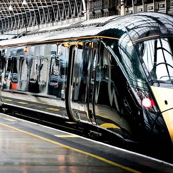 Sleek Black-Yellow Kingfisher Train At A Bright, Calm Station—Precision Engineering Reflected, Like Our Quality Grease Fittings.