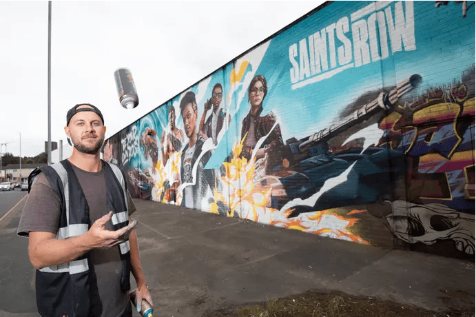 A Man Throwing A Spray Can Into The Air