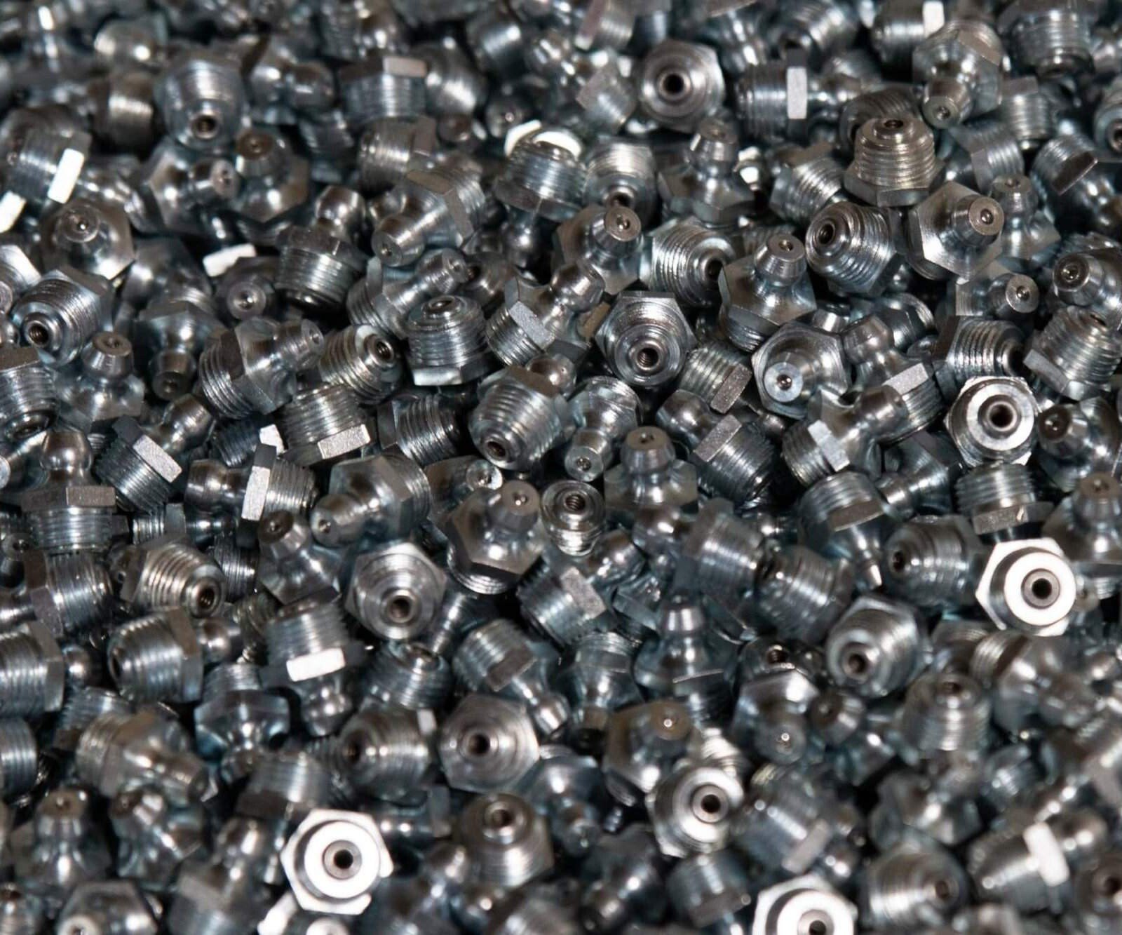 A Pile Of Metal Nuts